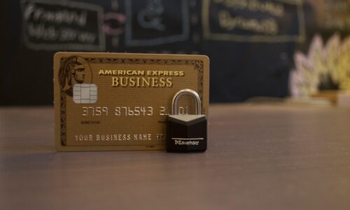 closeup photo of American Express Business card on brown surface