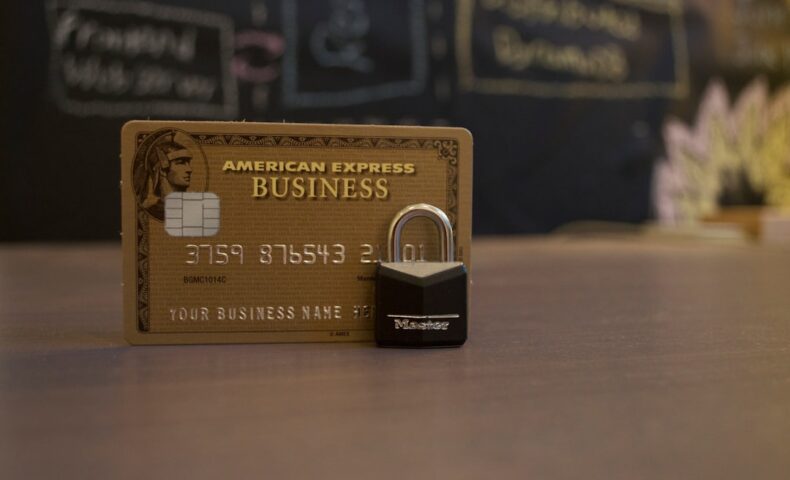 closeup photo of American Express Business card on brown surface